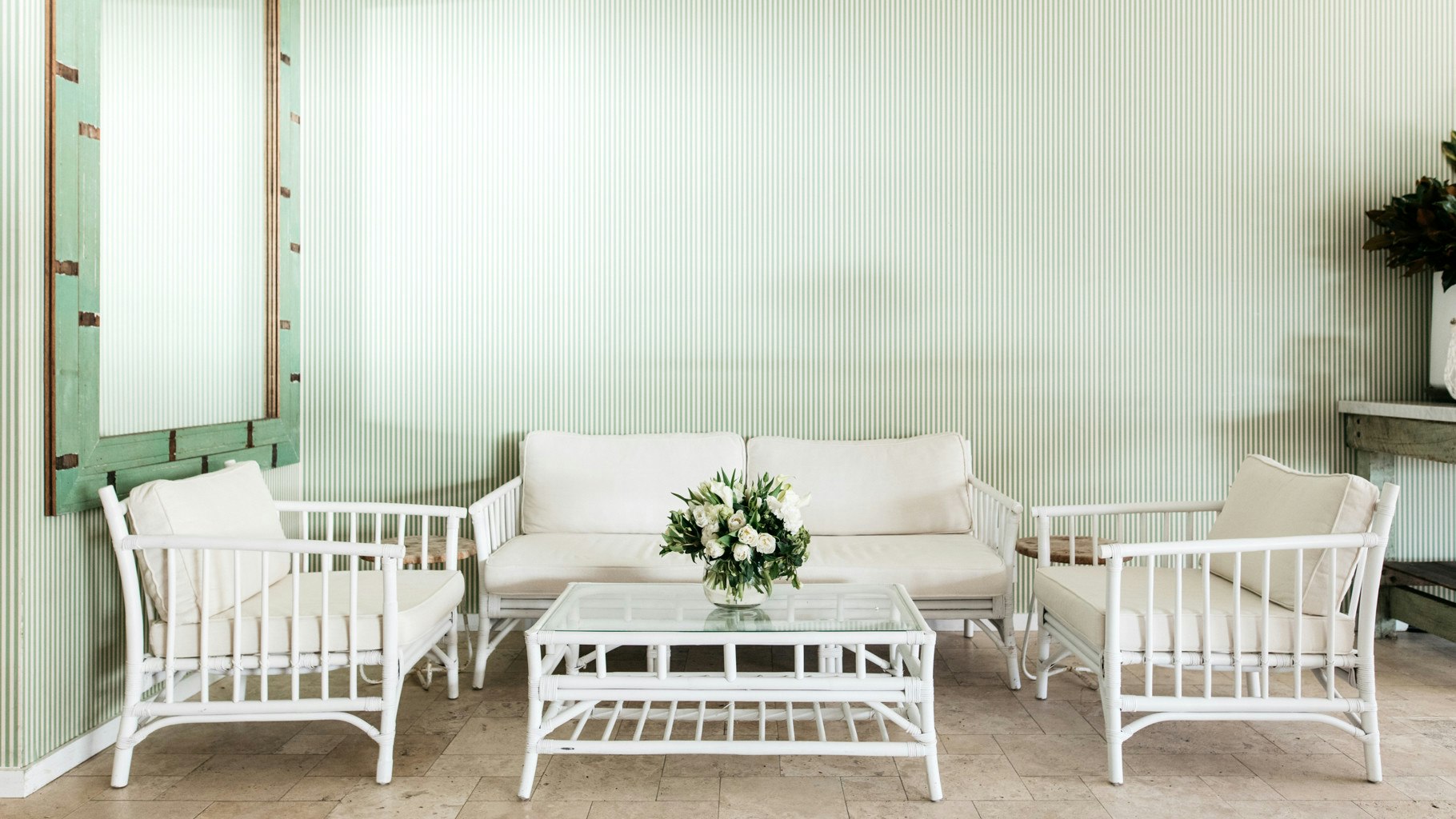 Seating and table arrangement for a wedding guest break-out area.